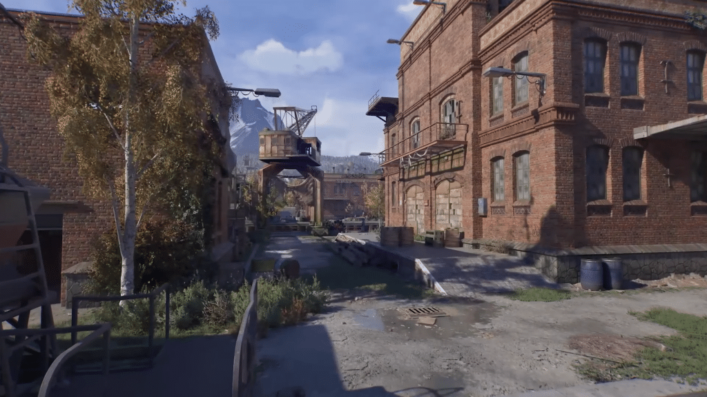 ambientazione di dying light the beast nelle alpi svizzere, fabbricati in mattoni con montagne sullo sfondo.
