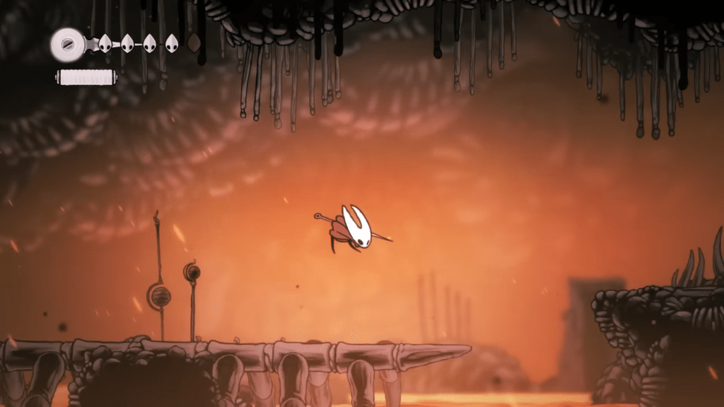 hornet salta in un’area infuocata di silksong, con hud visibile e atmosfera tesa