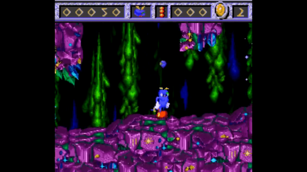 screenshot di izzy’s quest for the olympic rings ambientato in una grotta dalle pareti viola e verdi.