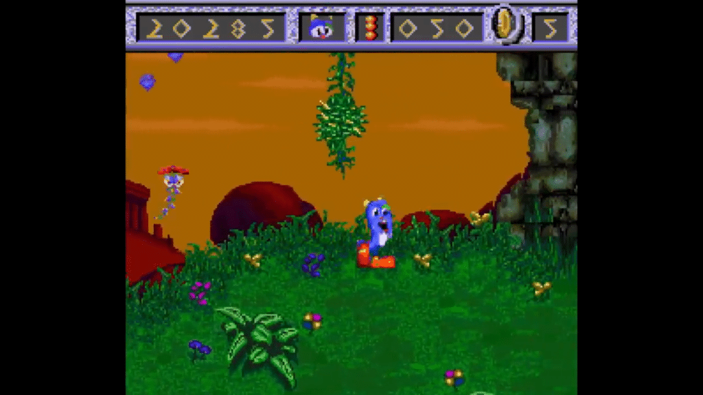 screenshot di izzy’s quest for the olympic rings con izzy in un livello ambientato in una foresta verde con sfondo arancione.